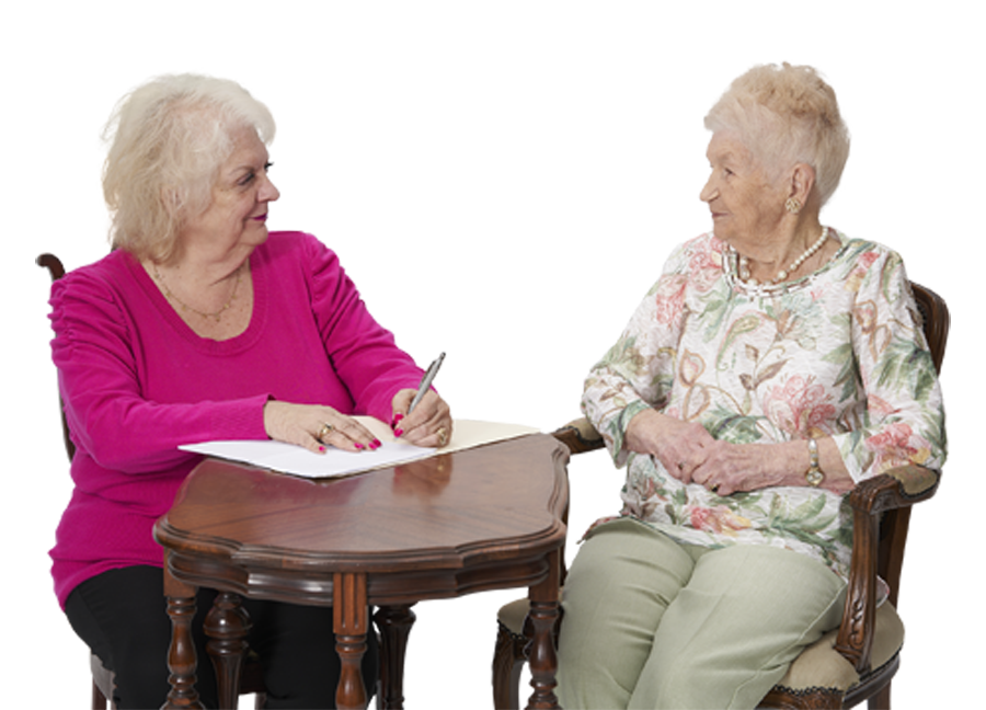 two woman sitting in chairs with one woman taking notes